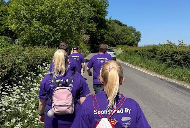 2. Wigan & Leigh Hospice supporters on the move during the 2025 Wigan Pub Walk.