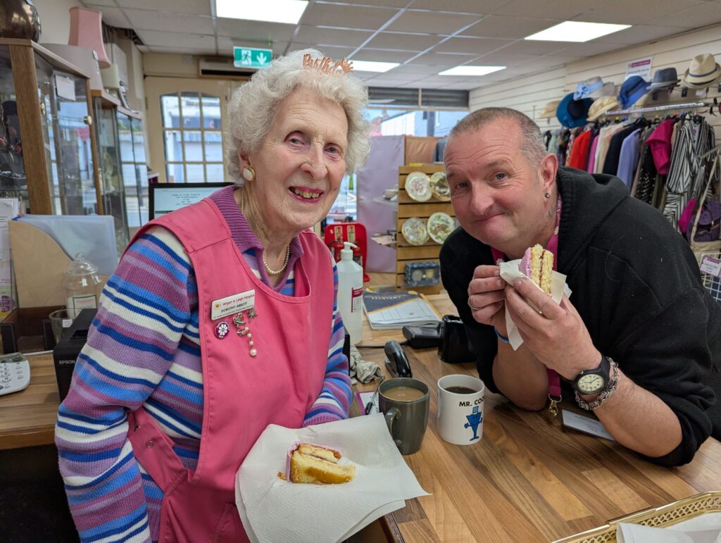 Dorothy and a fellow hospice volunteer enjoy some birthday cake.