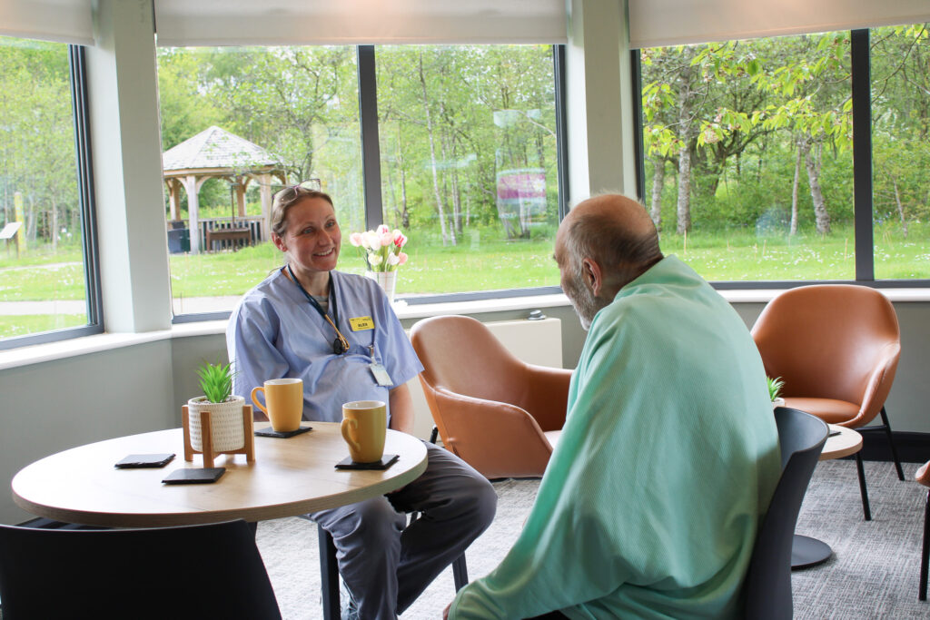 A doctor and patient chat.
