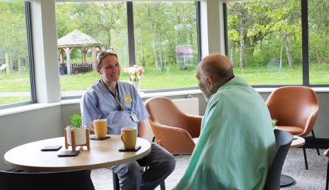 A doctor and patient chat.